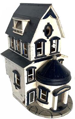 H976 Late 19th century wooden birdhouse in the form of an ornate Victorian House in old blue and white painted surface. Exceptional details throughout this two-story piece include a steep gabled roof complete with metal ridge cap, an oval window at the front peak of the house, dormer windows on each side of the roof, a cylindrical turret as the front entryway, a faux fenced area along one side, faux stone patio around the entryway and decorative woodwork trim throughout. Glass panes remain in some windows and doors.  The top section of the roof is removable to allow for clean out of nesting materials as needed. Skilled craftmanship is apparent in all sections of this wonderful piece. Measurements: 11 1/2" deep x 8" wide x 14" tall