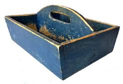 J352 19th century Pennsylvania original Soldier Blue painted Cutlery tray / knife box with curved center divider featuring an oval cutout for carrying purposes. Slightly canted sides. Square head nail construction. Very dry surface with wear indicative of use. Circa 1840 � 1850�s. Measurements: 13 ¼� x 11 3/8� x 6� tall (center).  The sides are 4� tall.