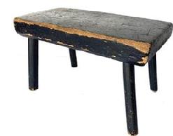 G495 Late 19th century stool with it�s original black paint rectangle top, resting on four plain and simple legs very sturdy