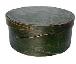 F526 19th century New England Pantry Box in its dry original Windsor green paint. Steamed and bentwood sides with opposing fingered body and lid secured with tacked and wooden pegged construction. Natural patina interior. Circa 1850s.  Measurements: 8� diameter x 3 &frac12;� tall.