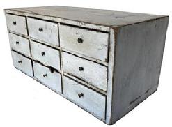 G176 19th Lancaster Pennsylvania, Country Store Apothecary Chest old white painted surface featuring nine dovetailed drawers in a fully dovetailed case. The wood is walnut. Measurements are: 25 1/2" long x 12" deep x 11 1/2" tall 