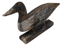 C417 Mid 20th century Silhouette of a wooden carved Loon, with etched wings, left side showing original paint there is paint lost on the right side due to the weather. Two wooden pegs mounted to a wooden base .