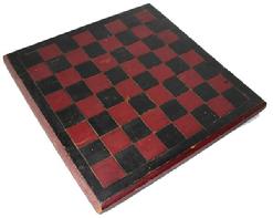B340 Late 19th century Game Board , with the original red and black paint, one board white pine construction, with a champfered edge, each block on the Game Board is deep scribed, to make each block stand out. carved on the back are the initials (C.C. H.)Measurements are: 14" x14"