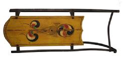 W59 ANTIQUE PAINT DECORATED CHILD�S SLED. red and blue, yellow paint decorated top, Wrought iron runners. some wear to the paint  