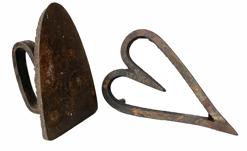 G492 Late 19th century Cast iron clothes iron, with an high applied handle, Surface pitting. Measurements: 6 1/2� tall x 4� wide x4 1/4� tall to top of handle. Cast iron heart shaped trivet - stamped on back �3� and �302 JW�. Measurements: 8 1/4� long x 5 1/4� wide x 1 1/2� tall  