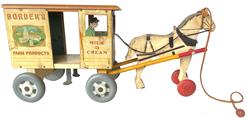G387 Rich Toys Tin Litho & Wood Borden's Dairy Horse Drawn Milk & Cream Wagon ca.1934 Very Good Condition Original paint.  Measures 19¾"L x 5"W x 9"H. "Rich Toys // Morrison, Illinois". Original paint. . E. M. and M. E. Rich founded Rich Manufacturing Company in 1915 to produce wood bows for the "open" cars of that time. In mid 1920's, with the popularity of closed cars, Rich Manufacturing Company had to find another woodworking focus creating Rich-Made Toys. In 1927, their wood toy production became so large that they moved to a new plant in Morrison, IL.Rich toys produced prior to 1931 were horse-drawn, wagon pull toys with no motion, , Rich Manufacturing Company has produced a wide range of products from automobile parts to refrigerator items to toys to water skies and much more. In 1953, the company moved to Tupelo, Mississippi and in 1962 a flood put Rich Toys out of business.View more great