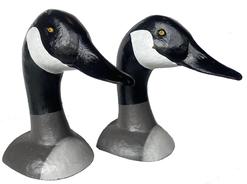 G529 Pair of cast iron book ends / door stops depicting the head of a Canadian Goose.  Original paint. Both are signed on the back of their respective base: �Bill Collins 2002�, and have felt covering the bottom of the base to protect the surface they are set upon.  Measurements:  6 ¾� deep at beak and the bases are 4 ½� wide x 3 ½� deep