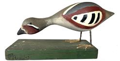 G712 Lloyd Tyler Folk Art carved decoy with metal legs - Approximate measurements: 9" long x 3 1/8" wide x 4 1/4" tall