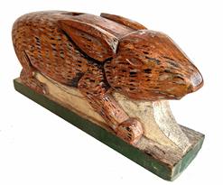 **SOLD** H118 Wooden hand carved Folk Art Rabbit in it's original paint decoration. all one piece of wood, very detailed carving of ears and mouth  Measurement 18 1/2 long x 8" tall x 4" wide 