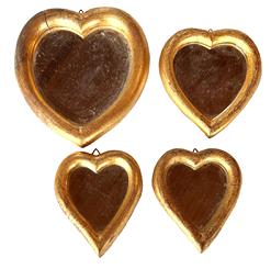 H244 Early 20th century set of four heart shaped mirrors with gold gilded wooden frames �with stamps/labels on backs that read �FLORENTIA� �Hand made in Italy�.  Great grouping with sizes that range from the largest measuring 7� tall x 6 ½� wide and the smallest measuring 4 ½� tall x 4� wide and each one retains its original hanger.