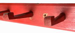 H83 Peg Rack with ten wooden pegs featuring chamfered edges in original dry, red painted surface. Each peg is mortised through the back board. 43� wide x 2 ¾� tall x 4� deep (at each peg)