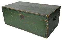 K220 New England storage box / trunk retaining original green painted surface with the initials L.D.M. hand painted in black on the top of lid. The top, front and sides of the box are adorned with a pinstriping detail also hand painted in black. Original forged iron handles remain intact on each end. Clean, natural patina interior with applied interior molding around the opening to help keep dust and moisture from seeping inside the box. Pine, one board, dovetailed and square head nail construction. Circa 1850s-1860s. Measurements: 29 wide x 15 ¾ deep x 11 ¼ tall.  