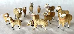 H327 Group of 12 antique putz, or stick leg, German wooly sheep and 1 ram. Various sizes and adornments. All are able to stand on their own. Great collection! 