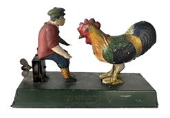 K130B 1920's Toyodo & Co (Japan) Wind-up Tin Toy depicting a Boy feeding a giant Chicken. Once wound up, the chicken pecks steadily. One side of the base reads Toyodo & Co and the opposite reads MADE IN JAPAN. The makers markings are found on each end of the base. The toy is missing the pan that was originally in the boys hands, but still works well. Base measures 7 ¼ long x 2 ¼ wide and it stands approximately 4 1/5 tall.