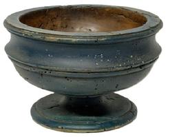 M1117 Mid-late 19th century wooden footed compote retaining its old blue paint. The raised lip around the top edge and wonderful turnings gracefully encircling top and bottom add a decorative look to this functional piece. Measurements: 9 &frac34;� top diameter x 6 &frac34;� bottom diameter x 6 &frac14;� tall. 