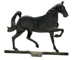 **SOLD** M1155 Cast iron Trotting Horse doorstop with nicely detailed double-sided embossed features, resting on a sturdy base. Solid cast iron with nice patina to original black surface. Circa 1920s-1940s. Measurements:12� long x 3 &frac14;� wide (base) x 10� tall.   
