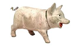 M1163C Paper mache� Pig shaped candy container with original curly tail � marked �GERMAN� on bottom. Constructed of paper mache� / composite material with removeable head and painted eyes and mouth/teeth details. Circa 1890-1900. Very good condition. Measurements: ~6� long x ~2� wide x ~3 &frac12;� tall. 