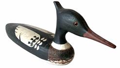 **SOLD** G791 Merganzer decoy � branded �HENDRICKS� on bottom. Possibly from the Hooper�s Island, Maryland area. Carver unknown. Measurements: 20 ½� long x 7 ½� tall x 4 ½� wide.