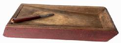 RM1482 Simplistic double-sided scrub / scouring box with great wear to one side and wonderful dry red paint. Slanted work surface on both sides. Tiny square head nail construction. Circa 1840s. (Knife included.) Measurements: 15 ½� long x 6� wide x 2� tall. 