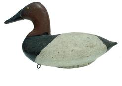 RM10 Graham was an undertaker and a cabinetmaker by trade, but he was also a hunting guide, and market gunner as well. Graham produced some of the earliest decoy that floated on the Flats. His decoys come in a variety of sizes and shapes. I have handled Grahams both with large bodies and small.  This wonderful Canvasback approx measures 14.25" x 6.25 