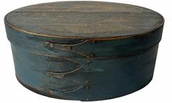 RM1369 Beautiful 19th century Shaker bentwood oval pantry box in original blue paint. Steamed and bentwood sides secured by a total of four left facing fingerlaps (three on the bottom and one on the lid) secured with early copper tacks.   Natural patina interior. Great condition! Measurements: 9 ¾� x 7� oval x 4� tall