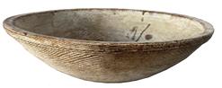 RM1313  Early 19th century New England small wooden beehive turned bowl in original oyster white paint. Bowl is slightly out of round and features a band around the rim tapering downward, showing strong evidence of slow lathe turning, and resting on slightly raised foot. The base of the bowl shows expected and desired chisel marks where the block was removed after turning. Measurements: 9 1/2� x 9 7/8� diameter and it is 2 3/4� tall 