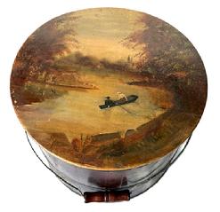 K1862 Late 19th century New England lidded wooden bucket with arched wire bail handle and turned wooden grip. The lid bears a hand painted river scene featuring a couple in a rowboat. Tongue and grooved staved construction held in place with metal bands. SPAULDING & FROST  FREMONT NH is stamped along the center of the bottom. (Spaulding & Frost Cooperage in Fremont, NH was founded in 1874.) Measurements: 12 ½ top diameter x 13 ½ bottom diameter x 12 tall. 