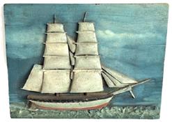 **SOLD** M133 Late 19th century handmade Folk Art Wooden Ship plaque depicting a full sail ship. Hand carved and painted details create the waves in the forefront. Measurements: 9 ¾ wide x 7 ½ tall. The back board is ½ thick.