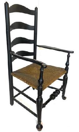 G877 DELAWARE RIVER VALLEY PAINTED LADDERBACK ARM CHAIR, featuring fine turnings. Retains an old black-painted surface. Late 18th/early 19th century.