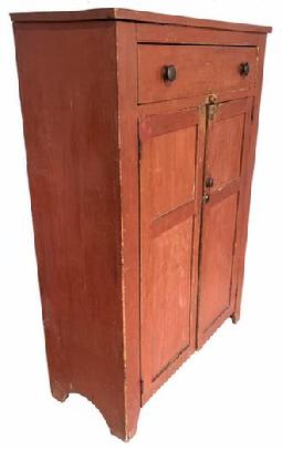 H520 Tall, early 19th century Pennsylvania original red painted jelly cupboard with one large, dovetailed drawer over two paneled doors. Half-moon cut out ends. Clean, natural patina interior with shelves for storage. Beaded edge around drawer and doors.
