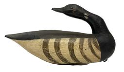M230 Brandt Decoy in a preening pose - carved by Gary Crossman ( d 2007) of Chincoteague, Virginia. Decoy bears tack eyes and original painted surface with its original weight and staple intact on bottom. Measurements: 13 &frac12;� long x 4 &frac12;� wide x 7 &frac12;� tall. 