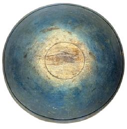 **SOLD** L489 Large, early 19th century hand turned solid wooden Dough Bowl bearing original dark blue painted surface with prominently lipped rim and evidence of slow lathe turnings throughout. Bowl rests on an ever so slightly footed base and retains great natural patina interior with wear indicative of years of use. Out of round. Extensive crack on each side (previously glued), one with an early make-do repair using wire staples. Measurements:  18� x 18 &frac12;� diameter x 5 &frac34;� � 6 1/8� tall (depending on where measured). 