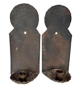 L435A Pair of matching late 18th century to early 19th century single-candle sconces with deeply fluted candle cups. The rolled tin / sheet metal construction features rounded tops, punched wriggle-work designs and rolled edges on the backs. Most American homes were lit with simple candle sconces such as these. This pair of New England Sconces have the best, uncleaned surface and remain in good original condition. Each sconce measures ~4 ½ wide x ~3 ½ deep x ~10 3/8 tall.
