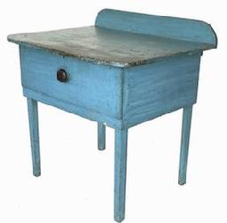 J266 Unusual New England one drawer table with backsplash retaining its stunning original robin egg blue painted surface. Rounded corners with applied breadboard ends on the top. Square head nail construction. Great surface. Measurements: 33 wide x 26 deep x 34 ¼ tall (back) x 301/2 tall (front)