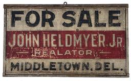 G151 Early 20th century wooden trade sign for "John Heldmyer. Jr. Realtor Middletown DE " painted on single board with breadboard ends, with white background and black and red as the other colors. Measurements are: 23" wide x 13 1/2"   