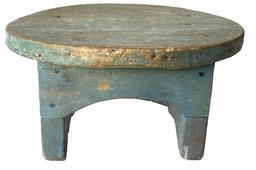**SOLD** G856  19th century Southern diminutive oval Stool in the original blue paint. Very unusual size with an arched apron that is mortised into the legs that boast cut-out ends.  Square head nailed construction. Measurements: 9 5/8� x 6 ¾� oval top x 5 ¼� tall