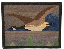 G862 GRENFELL FOLK ART PICTORIAL HOOKED MAT depicting a flying Canada Goose with evergreen trees lining the bottom edge. Very tiny colored fabric strips hand hooked on rectangular piece of burlap. Mounted and ready to hang. Grenfell Mission, northern Newfoundland in Labrador, Canada. Circa 1920.  Measurements: 9 3/8� wide x 7 3/8� tall