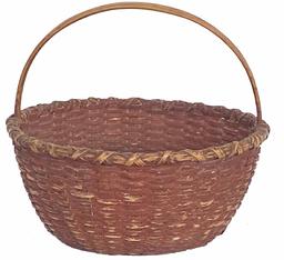 G871 Shenandoah Valley, Virginia painted stave-type woven splint basket retaining its original early red-painted surface. Constructed of white oak, very tightly woven in a circular form with X-wrapped rim, kick-up to bottom and arched handle.   Probably made by one of the Nichols family of basket makers from Page/Rockingham Co., VA. Fourth quarter 19th/early 20th century.  Measurements: sides are 6" tall. Overall height is 11 1/2". Opening of basket is 13 1/4" x 12 3/4" diameter