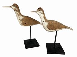 K66 Early 20th century pair of Shore Bird rig mates  each is branded "T. SMITH". They have wooden beaks/bills, tack eyes and the surfaces bear remnants of original paint as well as evidence of being shot over. Mounted on newly made, black painted wooden bases for display purposes. Each bird measures approximately 11 long x ¾ wide x 5 ½ tall. Mounted heights are 9 ½ tall and 10 ½ tall.   