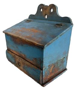 RM1632 Early 19th century Pennsylvania blue painted wall box with decoratively cut out back, hinged lid and drawer with divided interior below. Dovetailed case and drawer with rounded front and mortised, divided interior. Small square head nail construction. Circa 1800-1820. Measurements: 12 ¾ wide x 7 ¼ deep x 7 ½ tall (front) x 12 ¾ tall (back).