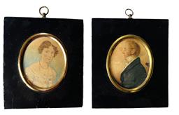 L28 Exceptionally detailed hand painted pair of miniature framed watercolor Portraits featuring a very distinguished, well-dressed man with glasses and a lovely curly-haired lady wearing a beautifully adorned bodice with several strands of beads and delicate earrings. Circa early 1800s. Measurements: 4 ½ wide x 5 tall. Oval portrait area is 2 ¾ wide x 3 ¼ tall.  