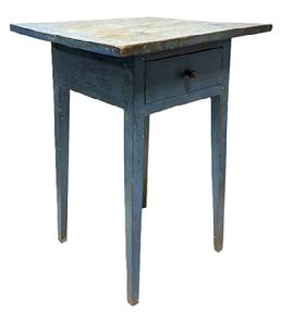 **SOLD** M1143 Late 18th to early 19th century Mid-Atlantic original blue painted one drawer Hepplewhite table featuring one board top with inlaid wood border resting on tall, delicate tapered legs. The apron is mortised into the legs and secured with wooden pegs. The drawer is dovetailed and retains its original wooden knob. The woods are walnut and pine. Circa 1790-1820. Measurements: 19� wide x 16 &frac34;� deep x 25 3/8� tall. Overhang of the top is 3 &frac14;� on front and sides, and 2� on back.