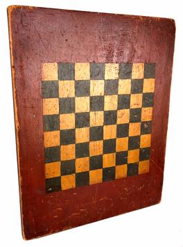 H207  19th century outstanding original painted checkers game board shows an outstanding original painted wood surface and is constructed from a single wide pine plank. The playing field is painted in mustard and black against a red  background the back of the board in untouched old natural surface. The board stands 21  inches in height and 16 1/2 inches in width.. This Game board has beautiful unclean surface 