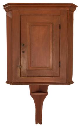 E579 Late 18th century Lancaster County  Pennsylvania Hanging Corner Cupboard, with an extending tail with shelf, original salmon paint, full mortised door with double pegs also picture frame molding, circa 1780 - 1810 Measurements 62 1/2 tall and will fit in a 22 corner