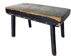 G495 Late 19th century stool with it�s original black paint rectangle top, resting on four plain and simple legs very sturdy  Measurements are:12� long x 6� wide x 7� tall 
