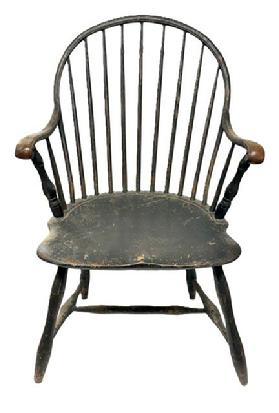 M241 Late 18th century Delaware Bow-back Windsor armchair retaining beautifully worn black over original salmon painted surface. Sturdy steamed and bent arms end in carved knuckle handholds. One board seat. Nice turnings.  Great wear � especially on each of the arms and seat front. The chair measures 22� wide across front of arms. Seat is 17 &frac14;� deep x 19� wide x 16 &frac12;� tall from floor. Overall height of chair back is 37� tall. 