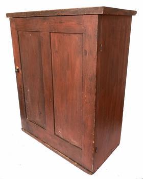 G319 19th century original red painted hanging Cupboard, with two panel door with a divider interior one board construction with square head nails