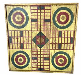 H457 19th century American, beautifully painted Parcheesi game board found in Pennsylvania. Vividly painted in red and green on a yellow background with matching yellow painted molding, secured by tiny square head nails, applied on all sides. Original dry surface with signs of wear indicative of age and use. The back of this game board shows it was cleverly constructed of two heavy wooden shutters � still bearing their weathered surface with beautiful relief carved pattern of flowers, leaves and vines. Measurements: 20 ½� square x 1 1/8" thick