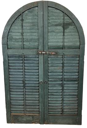 H33 Large arched  wooden window Louvers in old dry green painted surface with original hardware. Mortised construction. Detailed workmanship throughout. Great condition. Measurements: 40 1/4" wide x 1 1/4" thick x 62 1/4" tall