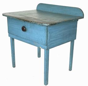 J266 Unusual New England one drawer table with backsplash retaining its stunning original robin egg blue painted surface. Rounded corners with applied breadboard ends on the top. Square head nail construction. Great surface. Measurements: 33� wide x 26� deep x 34 ¼� tall (back) x 301/2� tall (front)